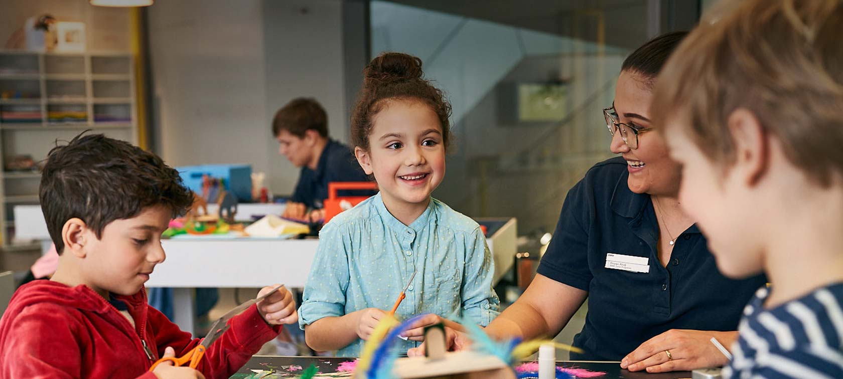 Children make creative car models out of cardboard